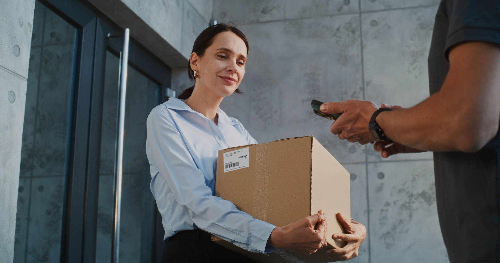 Businesswoman Receiving Package with Online Shopping Order, Signing POD on Smartphone